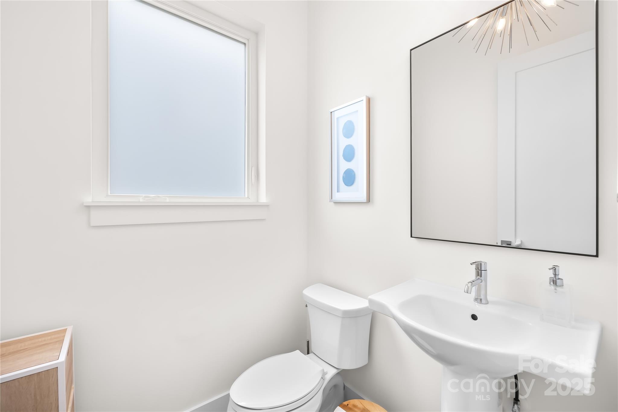 1627 Rama Road Charlotte, NC 28211 - Photo 26 of 43 a white toilet sitting next to a bathroom sink