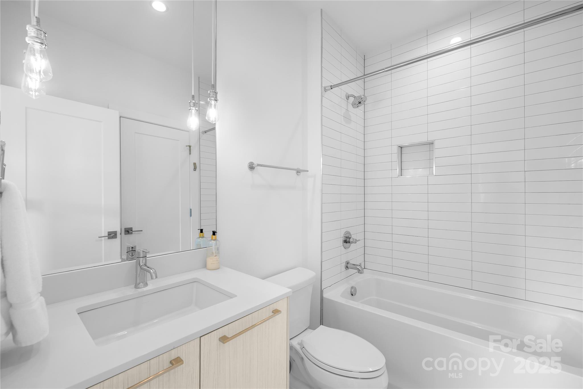 1627 Rama Road Charlotte, NC 28211 - Photo 30 of 43 a bathroom with a sink toilet vanity and shower