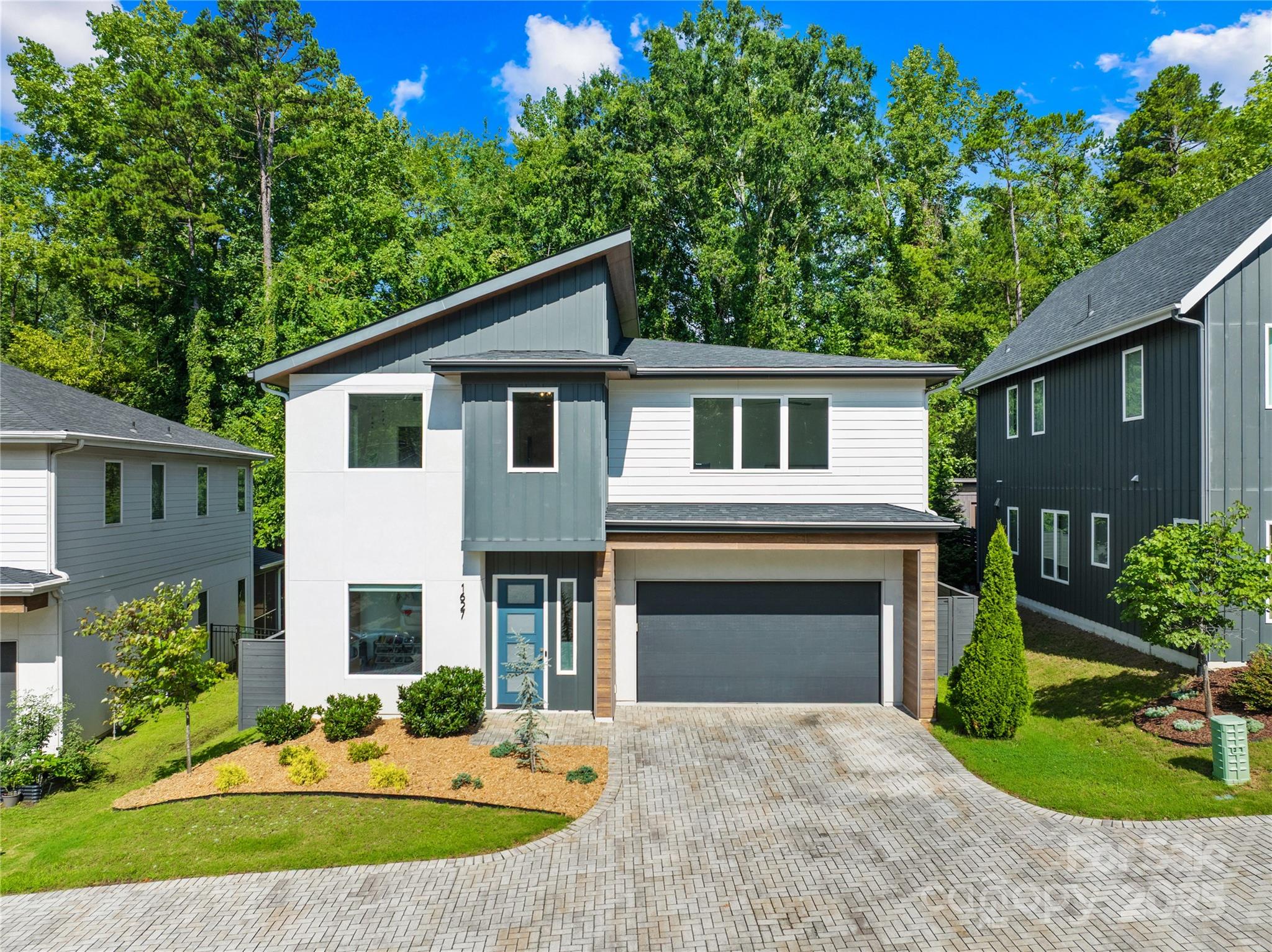 1627 Rama Road Charlotte, NC 28211 - Photo 3 of 43 a front view of a house with a yard and garage