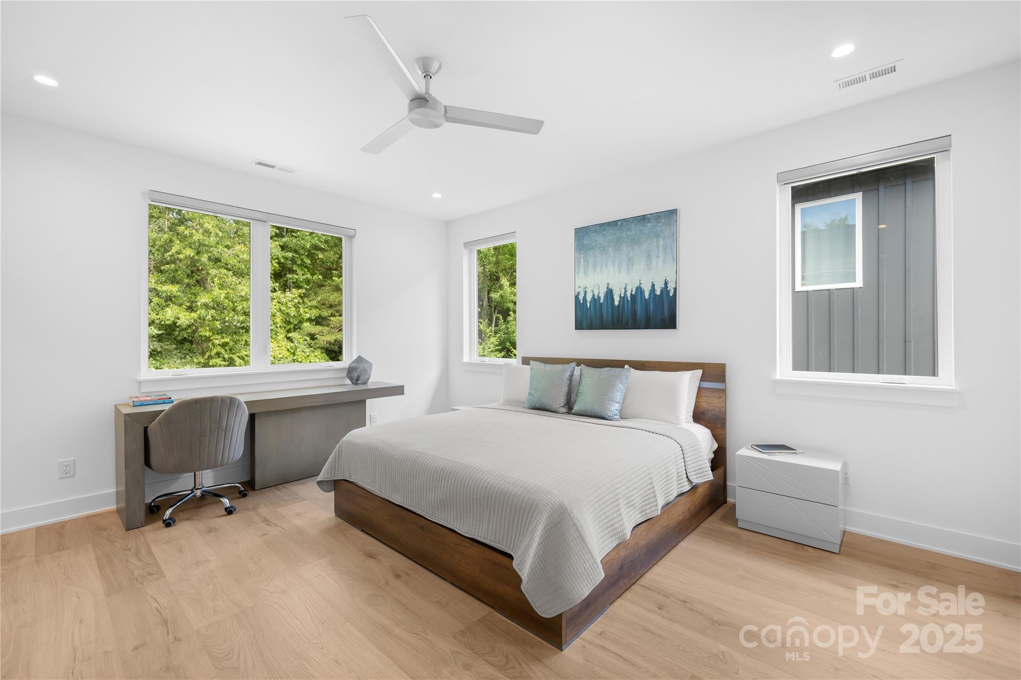 1627 Rama Road Charlotte, NC 28211 - Photo 34 of 43 a spacious bedroom with a bed and a table in it