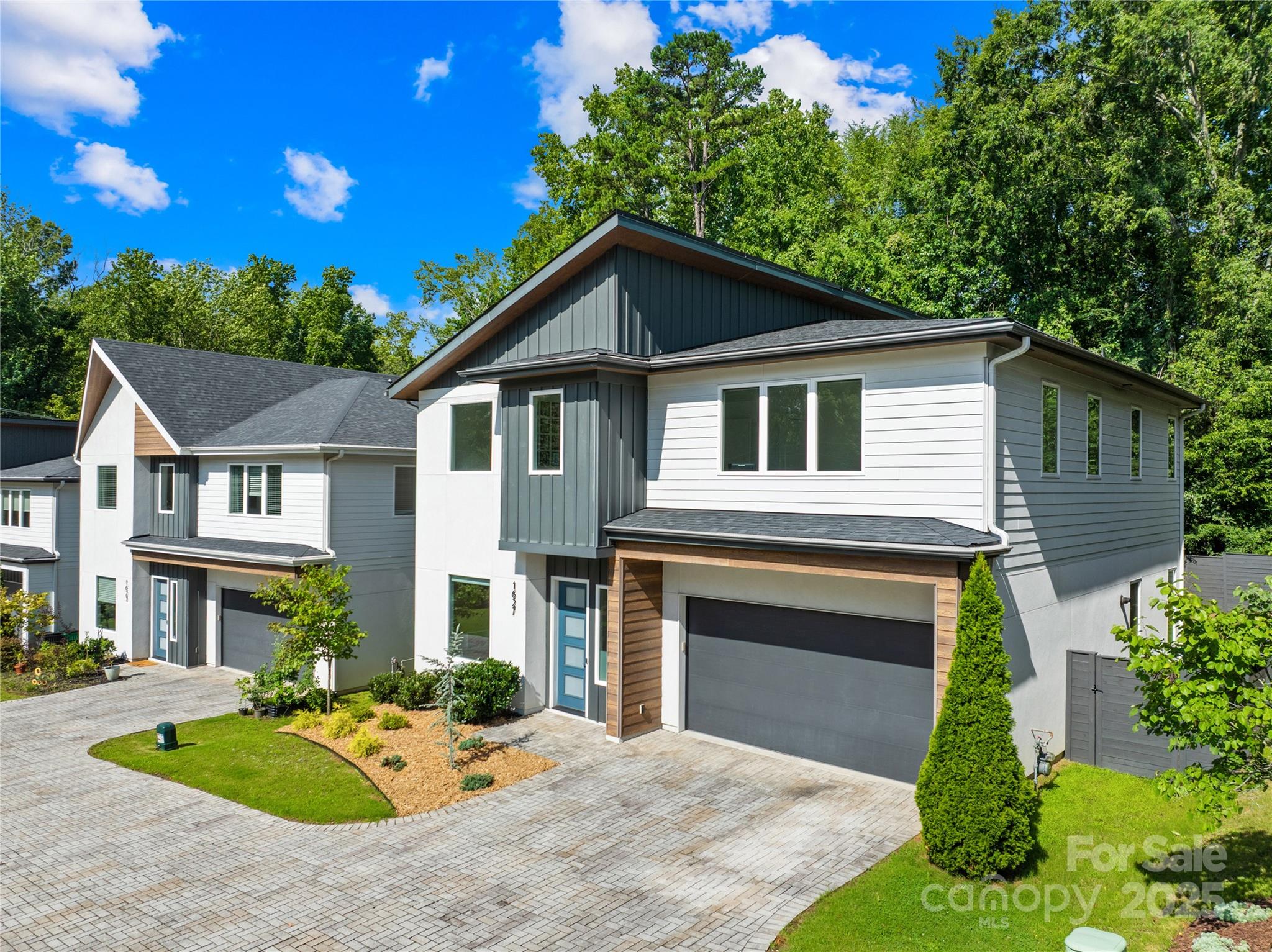 1627 Rama Road Charlotte, NC 28211 - Photo 4 of 43 a front view of a house with yard porch and garage