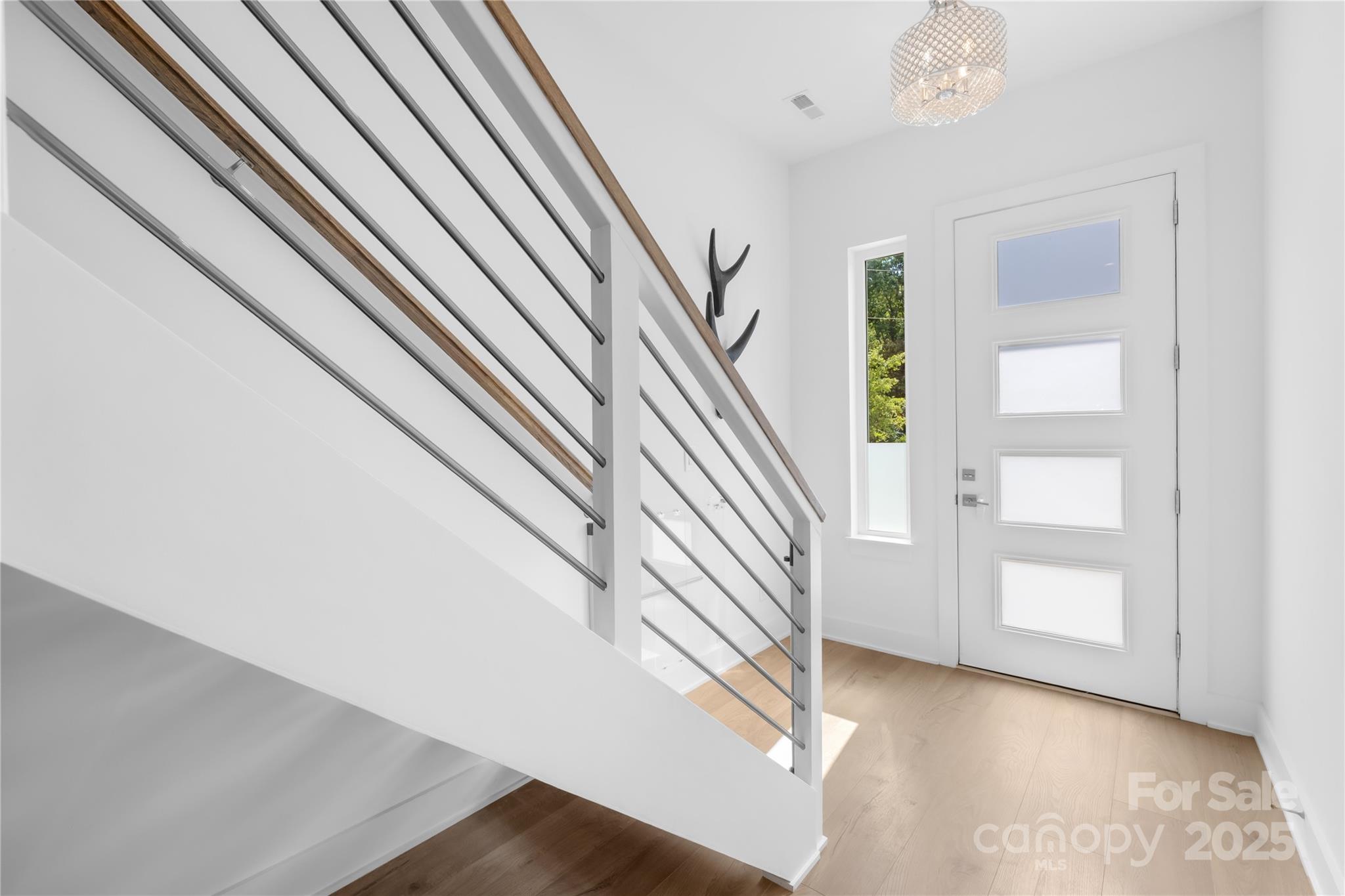 1627 Rama Road Charlotte, NC 28211 - Photo 10 of 43 a view of entryway and hall with wooden floor