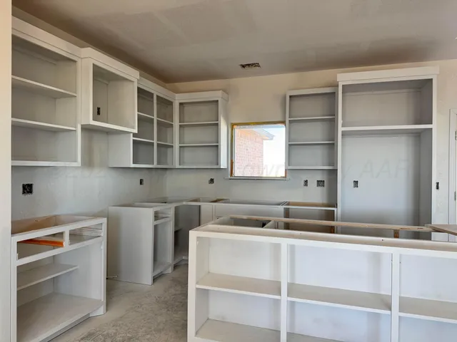 a room with a stove and a sink