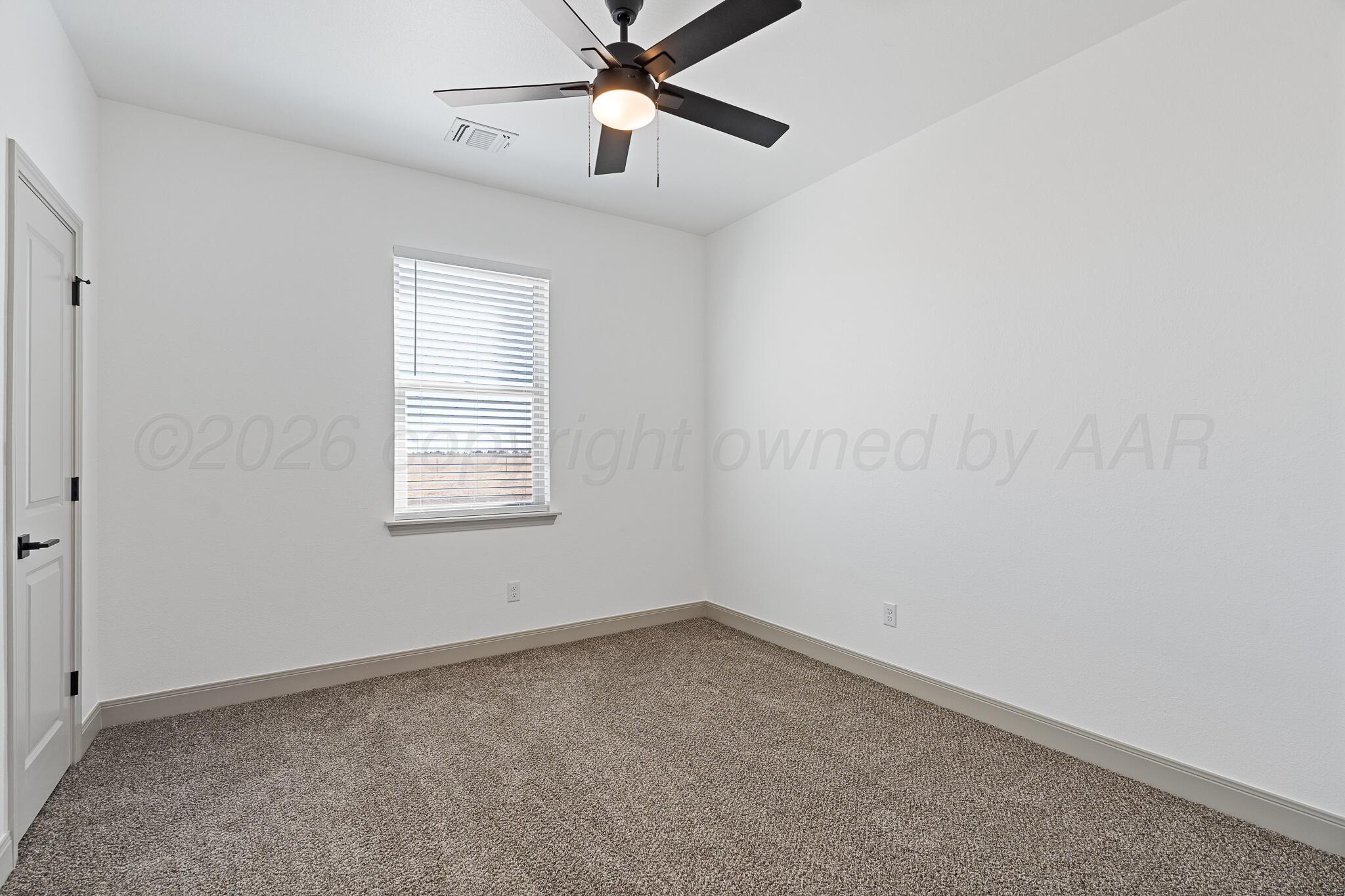 21700 Farm To Market Road 2219 Amarillo, TX 79119 - Photo 26 of 38 an empty room with a window and a fan