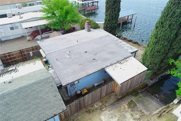 an aerial view of a house with a yard