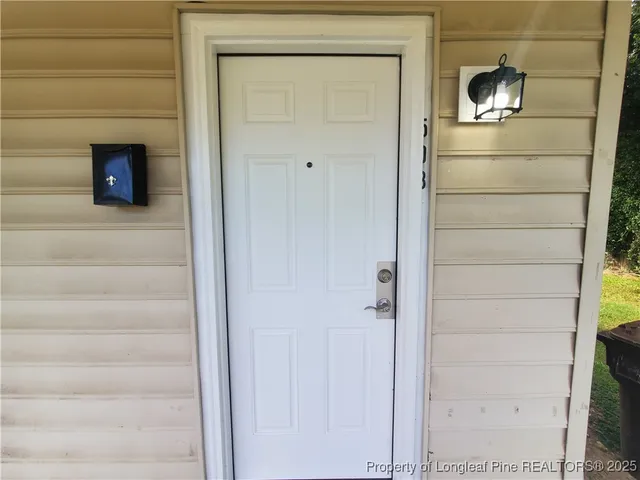 a kitchen with a refrigerator and cabinets