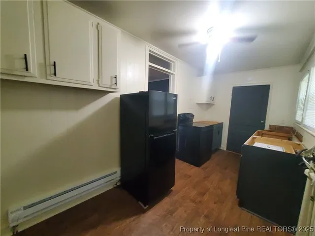 a kitchen with stainless steel appliances a refrigerator and a stove