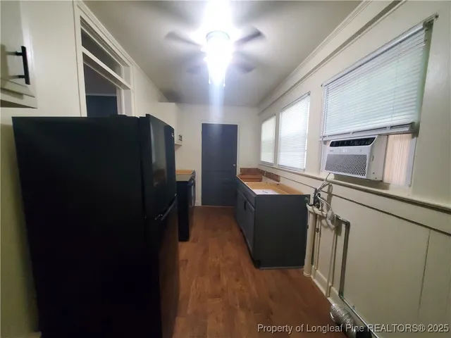 a kitchen with a refrigerator and washer