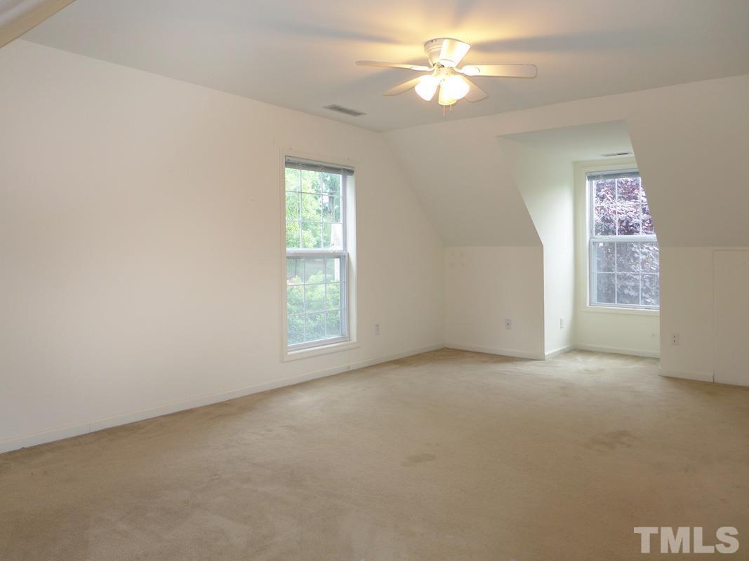 308 Davie Road Carrboro, NC 27510 - Photo 14 of 21 an empty room with windows and fan