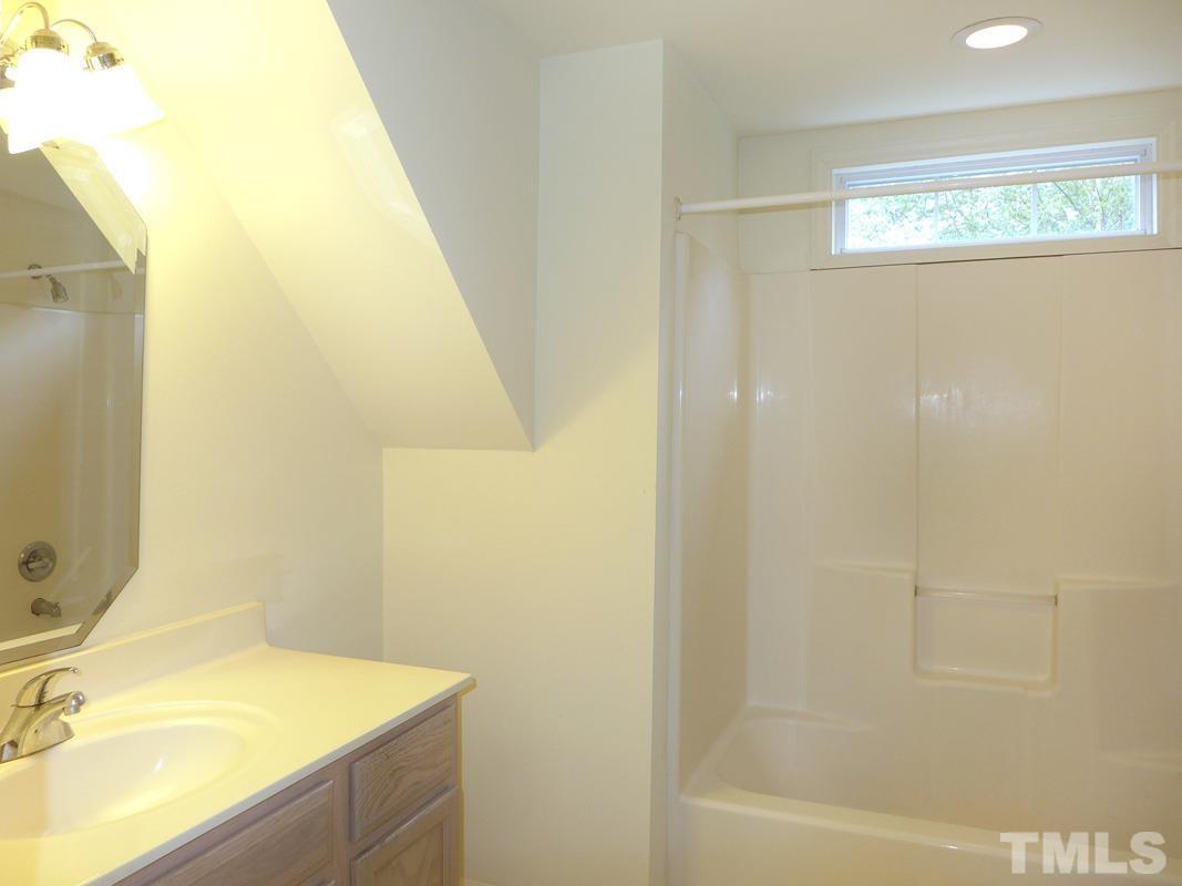 308 Davie Road Carrboro, NC 27510 - Photo 16 of 21 a bathroom with a sink and a mirror