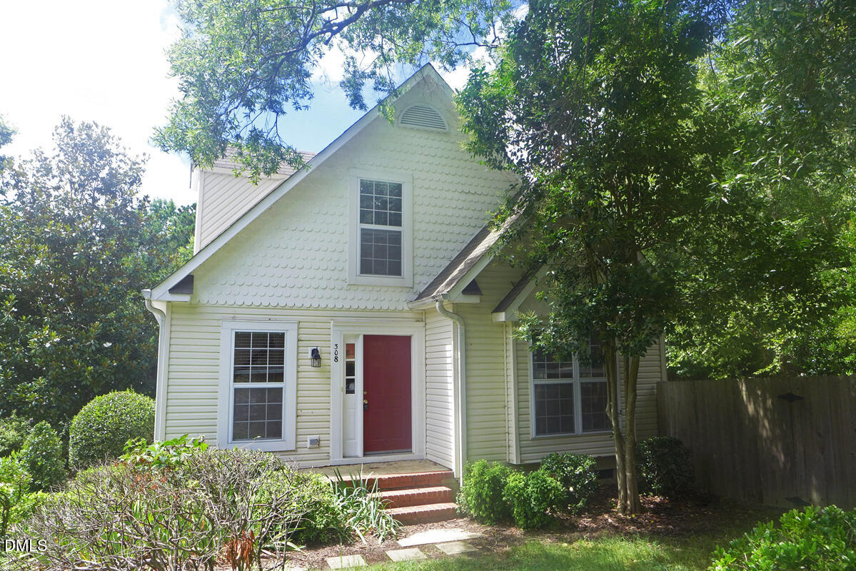 308 Davie Road Carrboro, NC 27510 - Photo 20 of 21 a front view of a house with garden