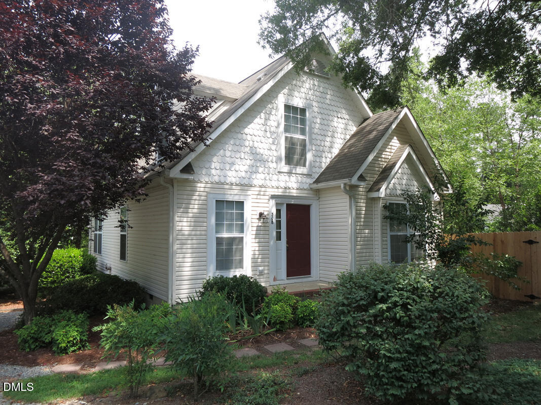 308 Davie Road Carrboro, NC 27510 - Photo 21 of 21 a front view of house with green space