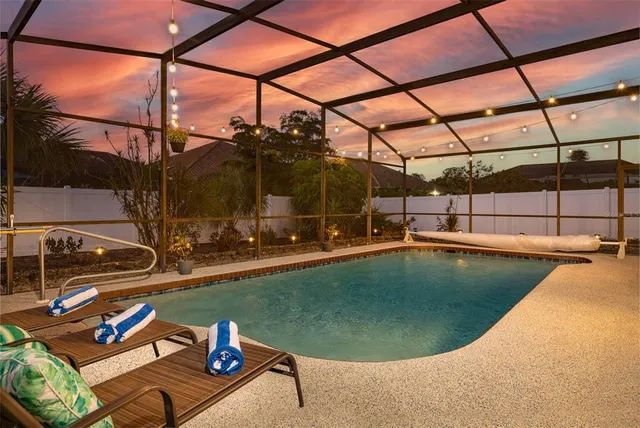 a view of a swimming pool with a patio