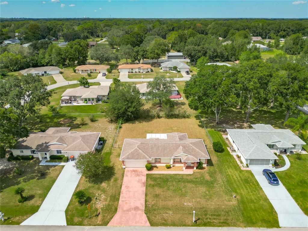 10583 Southwest 62nd Ter Road Ocala, FL 34476 - Photo 2 of 59 an aerial view of residential houses with outdoor space