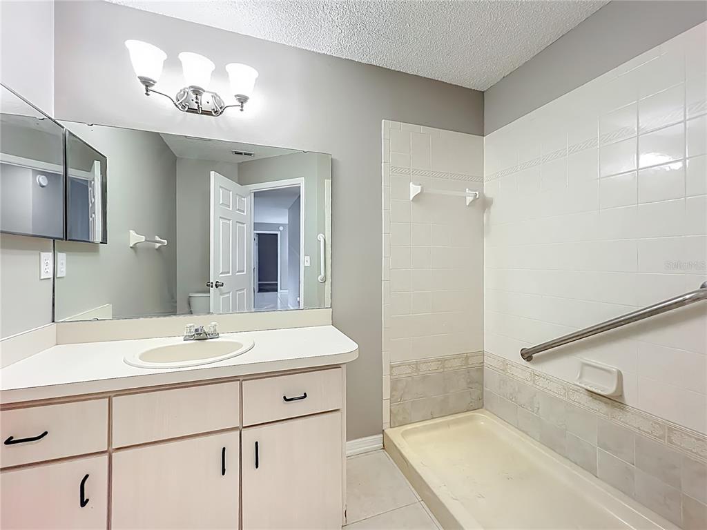 10583 Southwest 62nd Ter Road Ocala, FL 34476 - Photo 24 of 59 a bathroom with a sink and a mirror