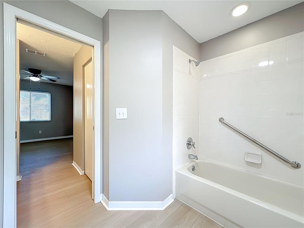 10583 Southwest 62nd Ter Road Ocala, FL 34476 - Photo 30 of 59 a bathroom with a bathtub and a shower