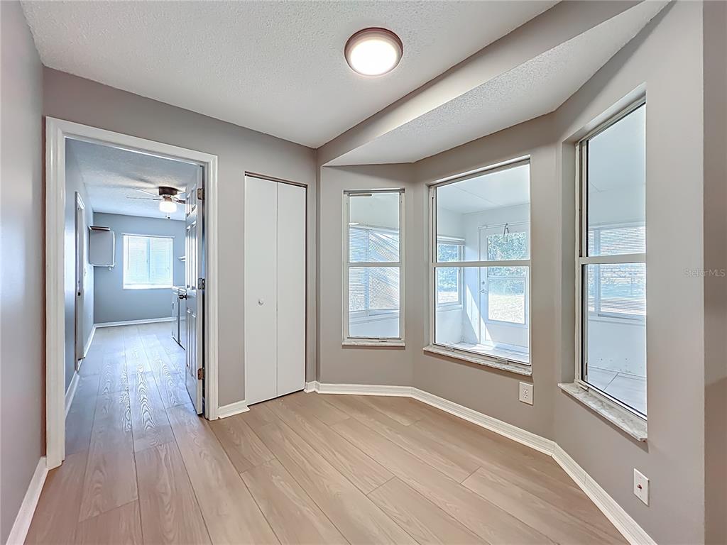 10583 Southwest 62nd Ter Road Ocala, FL 34476 - Photo 32 of 59 wooden floor in an empty room with a window