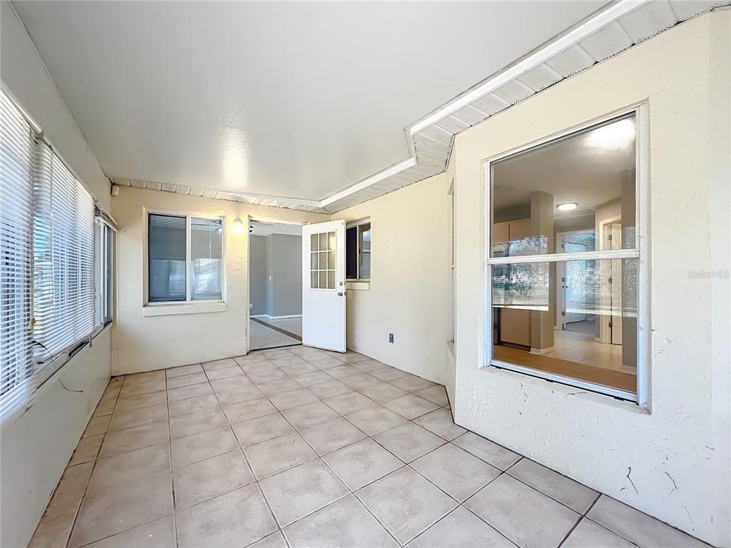 10583 Southwest 62nd Ter Road Ocala, FL 34476 - Photo 37 of 59 a view of an empty room with glass door