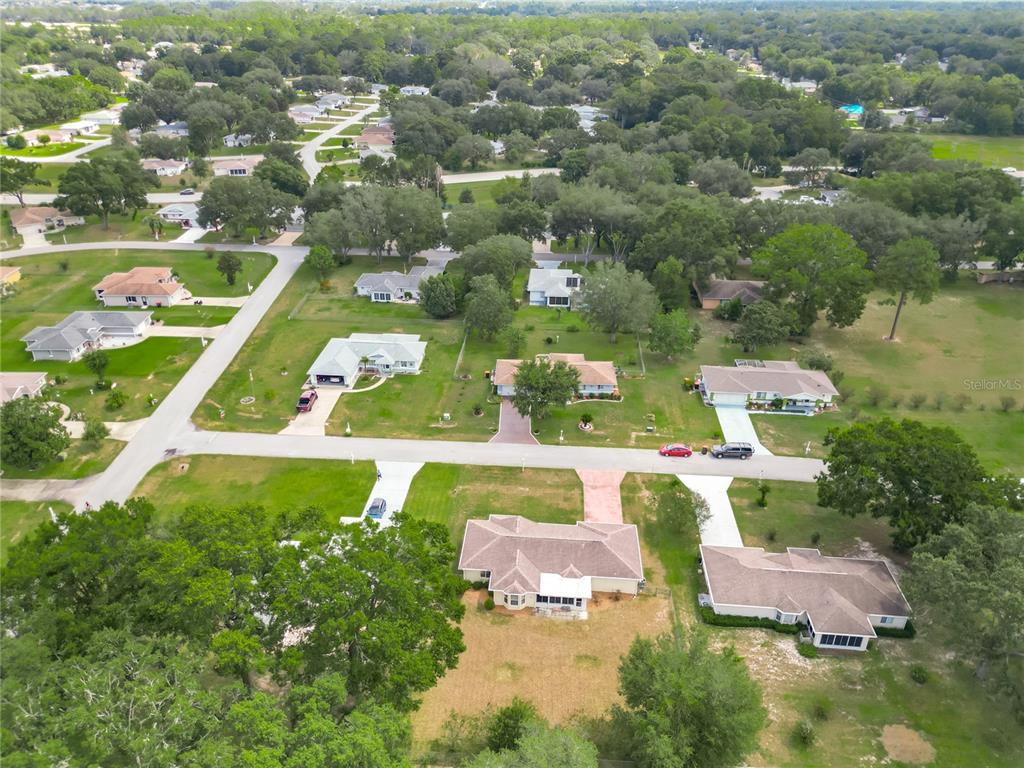 10583 Southwest 62nd Ter Road Ocala, FL 34476 - Photo 48 of 59 an aerial view of residential houses with outdoor space and swimming pool