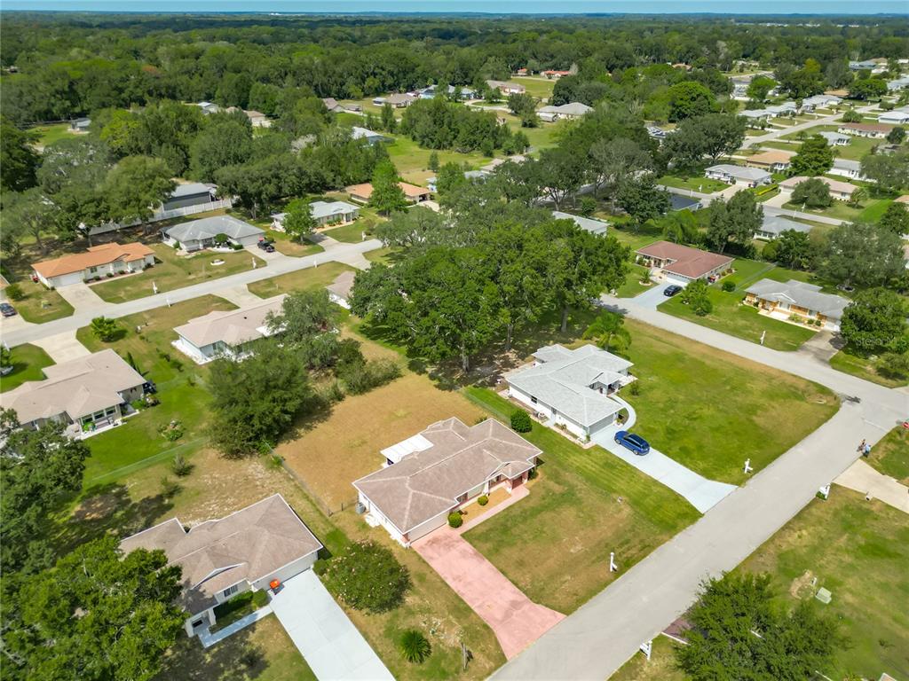 10583 Southwest 62nd Ter Road Ocala, FL 34476 - Photo 50 of 59 an aerial view of residential houses with outdoor space