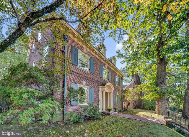 a view of a building with a yard