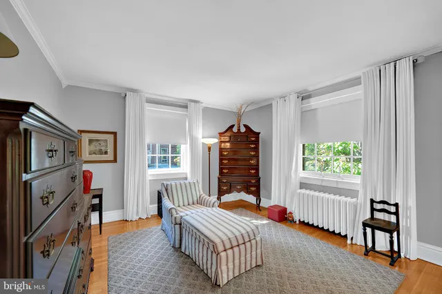 a bedroom with furniture and a window