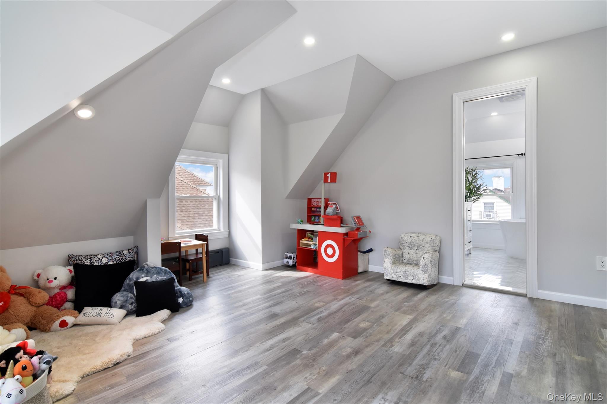 16 Badeau Place New Rochelle, NY 10801 - Photo 11 of 27 a bedroom with furniture and wooden floor
