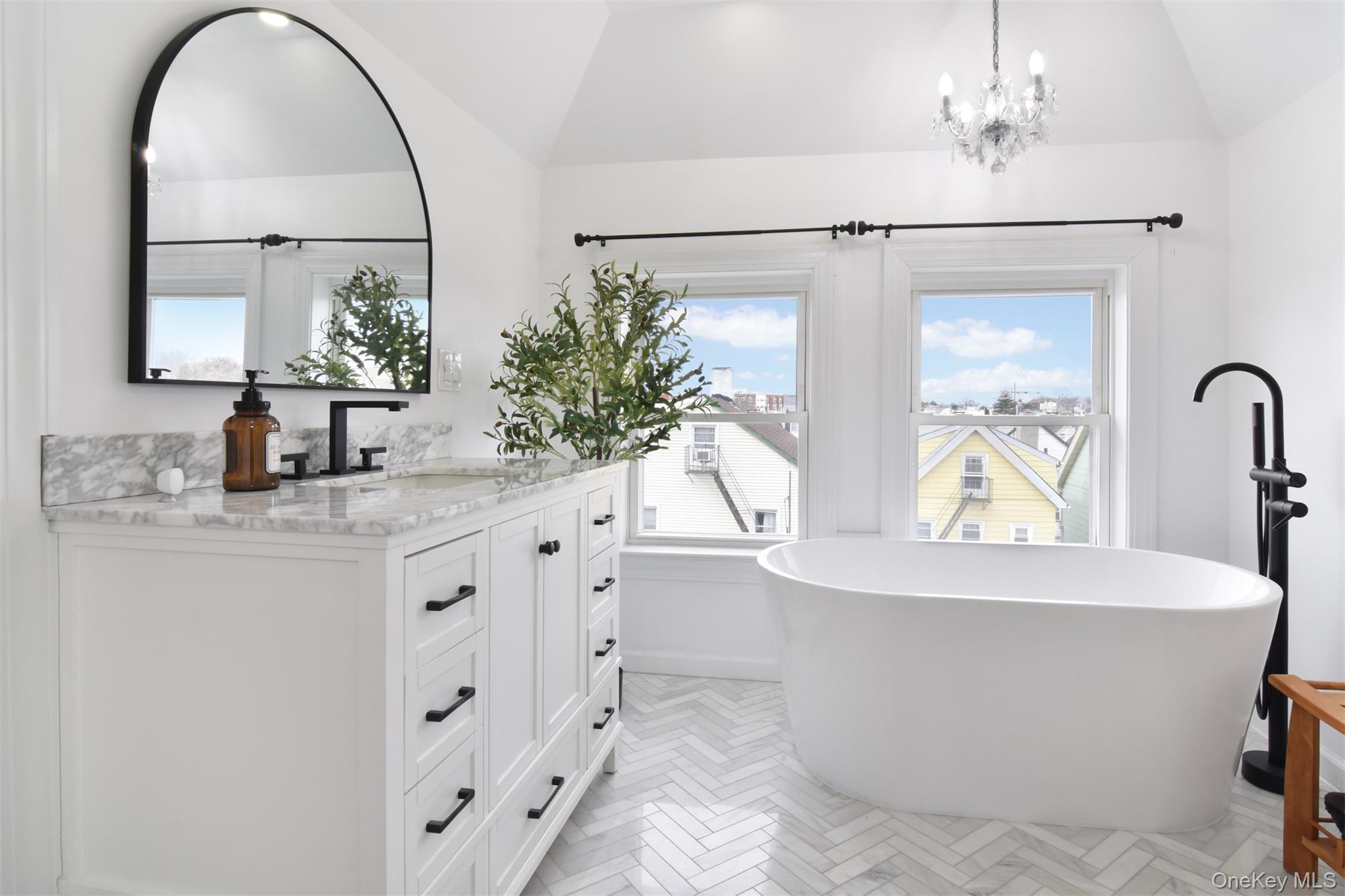 16 Badeau Place New Rochelle, NY 10801 - Photo 12 of 27 a bathroom with a bathtub and a sink