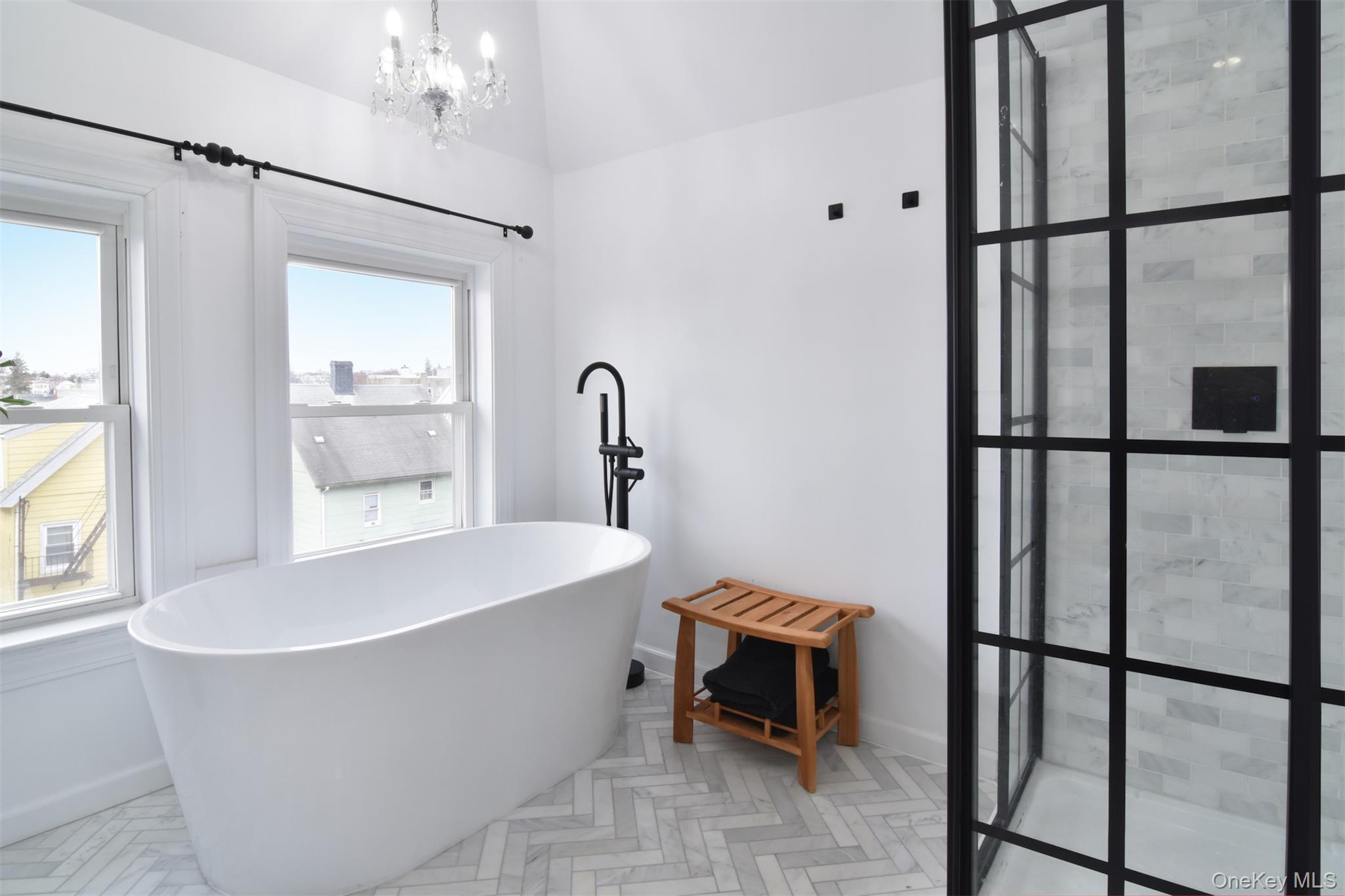 16 Badeau Place New Rochelle, NY 10801 - Photo 13 of 27 a white bath tub sitting next to a window