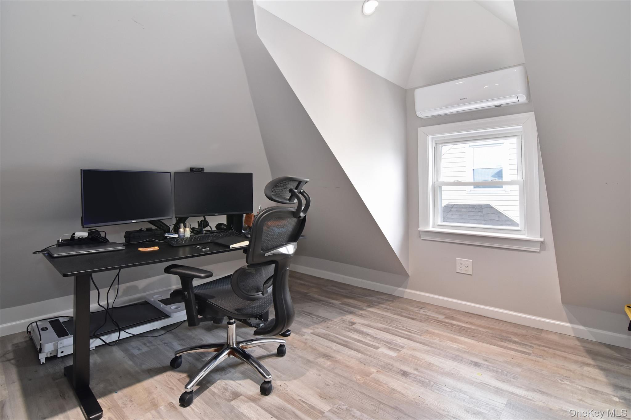 16 Badeau Place New Rochelle, NY 10801 - Photo 18 of 27 a view of a workspace with furniture and a window