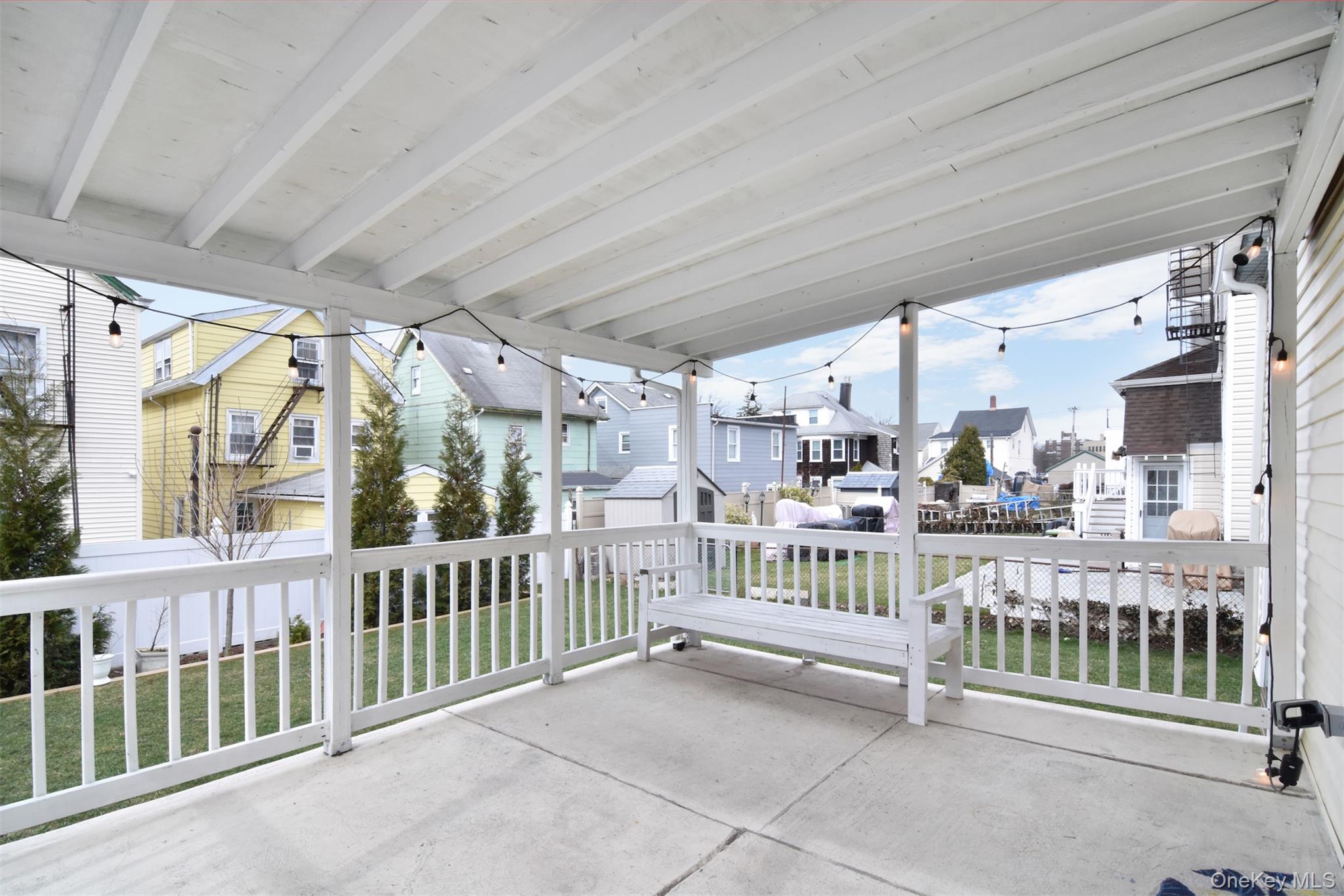 16 Badeau Place New Rochelle, NY 10801 - Photo 19 of 27 a view of a porch with wooden floor