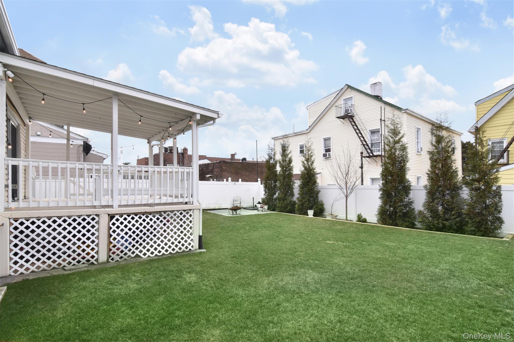 16 Badeau Place New Rochelle, NY 10801 - Photo 21 of 27 a view of a porch with a yard