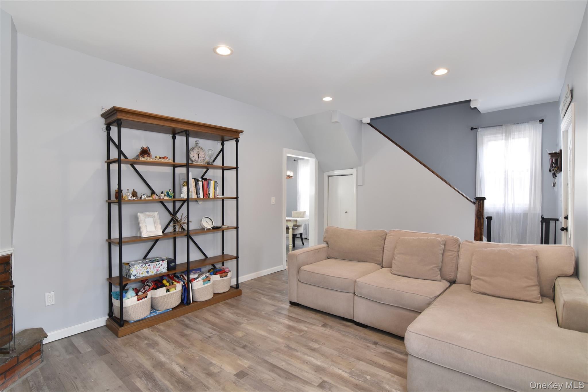 16 Badeau Place New Rochelle, NY 10801 - Photo 4 of 27 a living room with a couch and a wooden floor