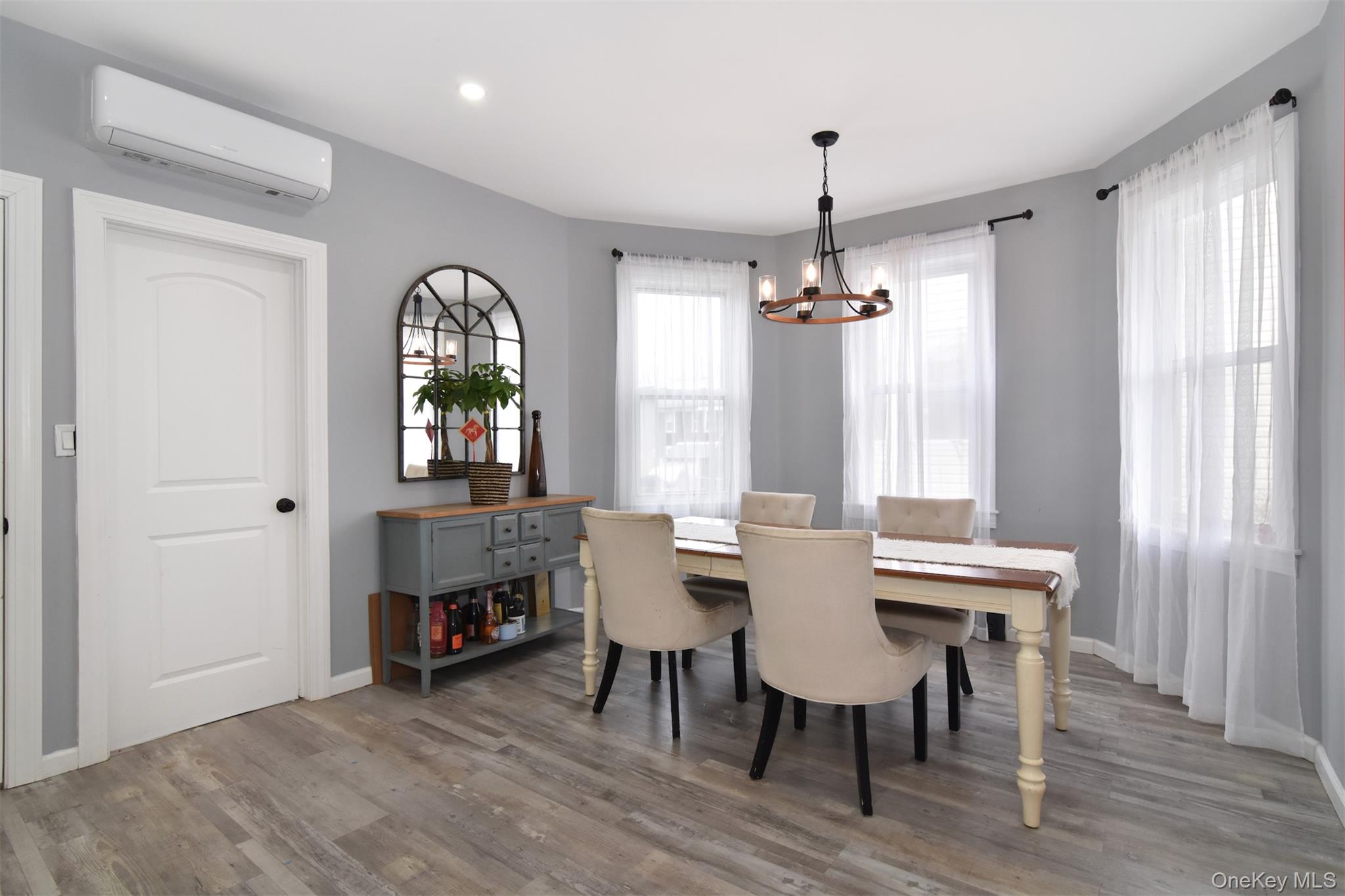 16 Badeau Place New Rochelle, NY 10801 - Photo 7 of 27 a view of a livingroom with furniture window and wooden floor