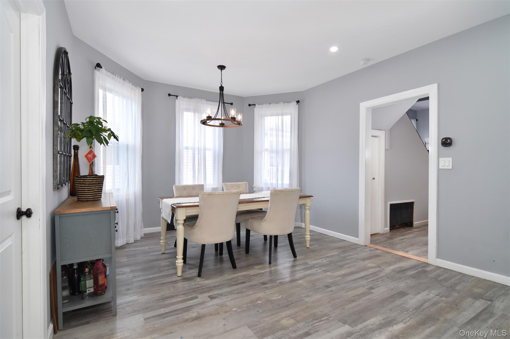 16 Badeau Place New Rochelle, NY 10801 - Photo 8 of 27 a view of a dining room with furniture and wooden floor