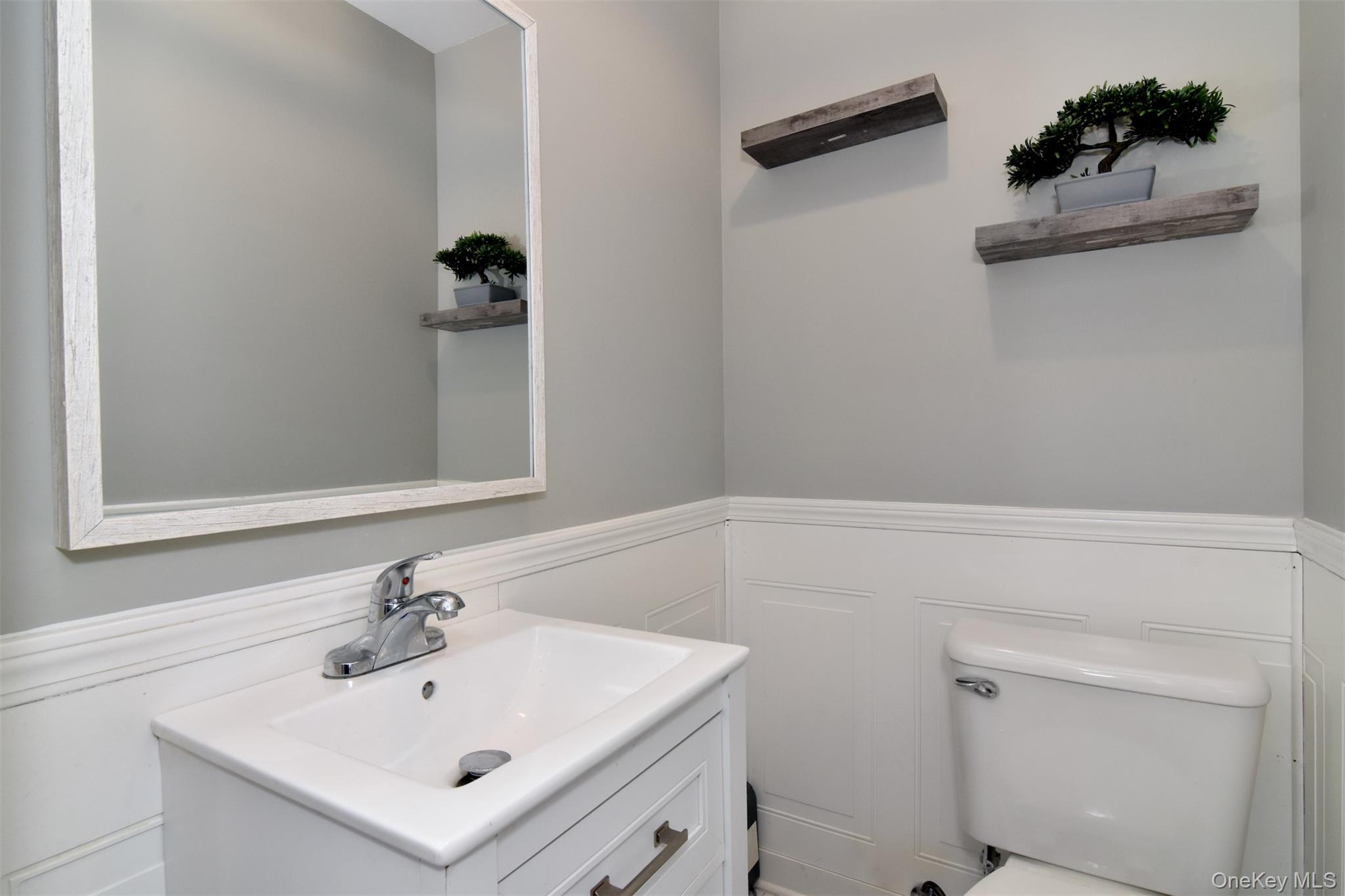 16 Badeau Place New Rochelle, NY 10801 - Photo 9 of 27 a bathroom with a sink and a toilet