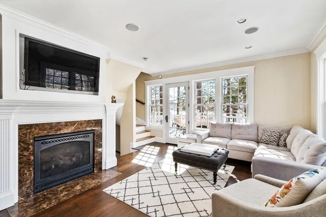 a room with pool table and windows
