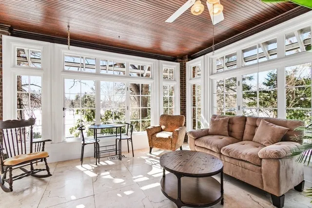a room with furniture and a flat screen tv