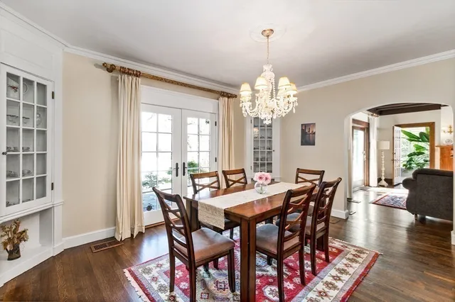 a living room with patio furniture and a large window