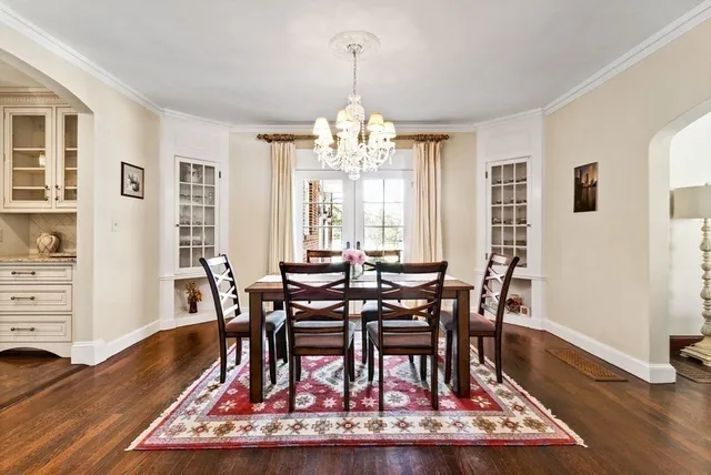 a bedroom with double bed and a mirror