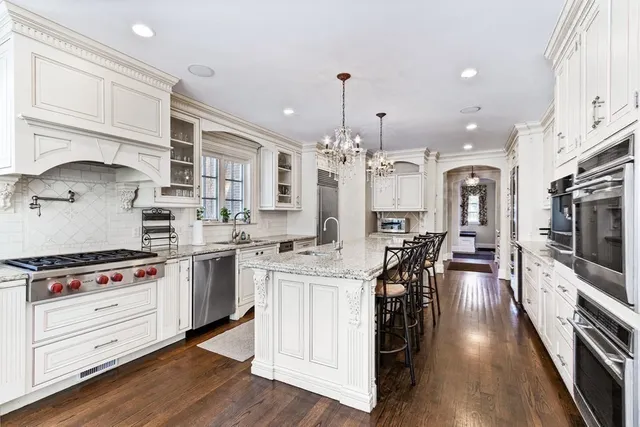 a bedroom with a bed and a mirror on the dresser