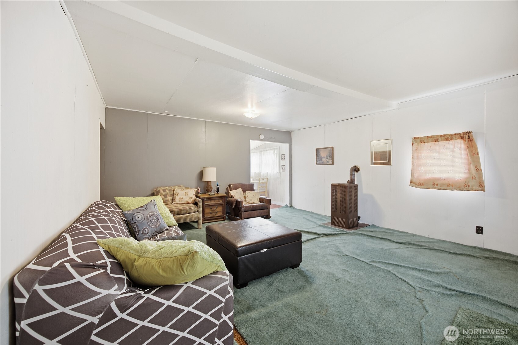 38 A Main Street Methow, WA 98834 - Photo 15 of 34 a living room with furniture and a window