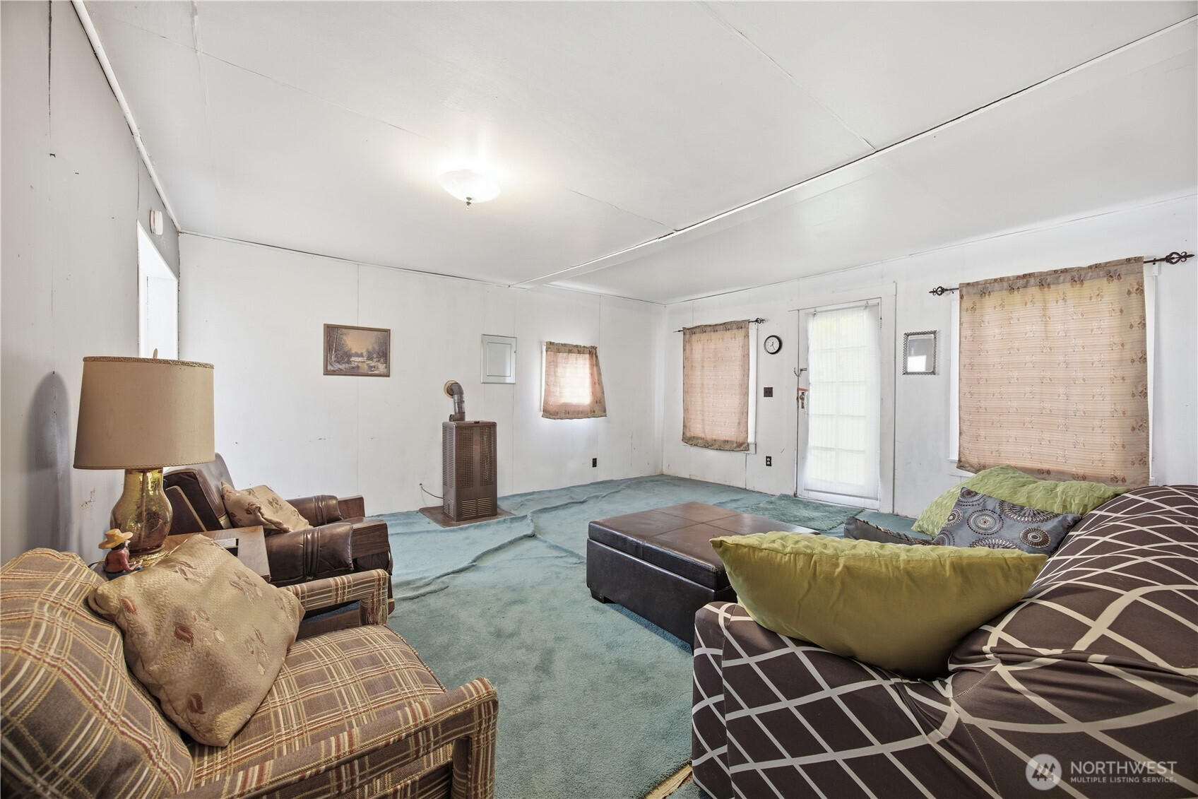 38 A Main Street Methow, WA 98834 - Photo 16 of 34 a living room with furniture and a couch