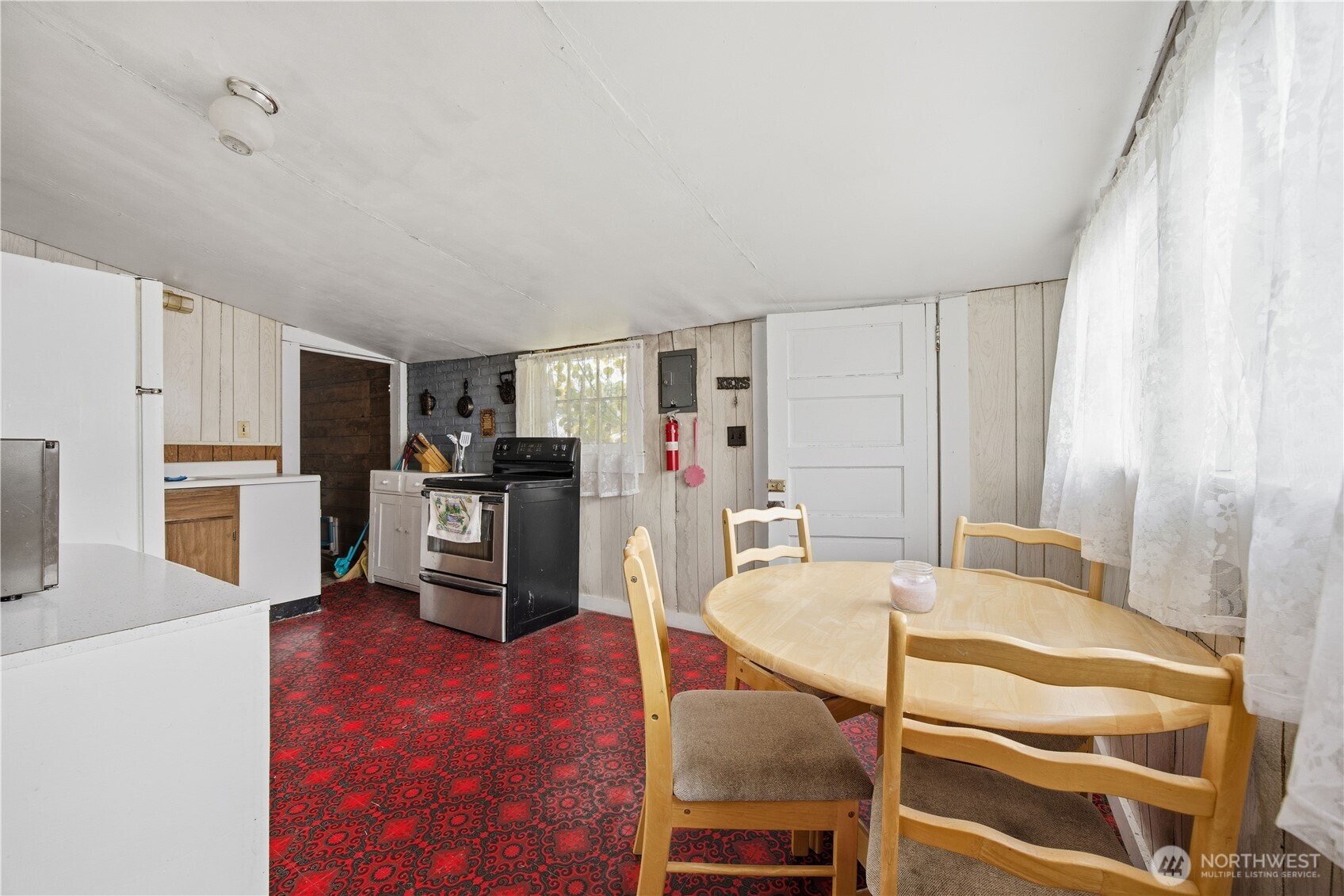 38 A Main Street Methow, WA 98834 - Photo 20 of 34 a living room with stainless steel appliances furniture and a kitchen view