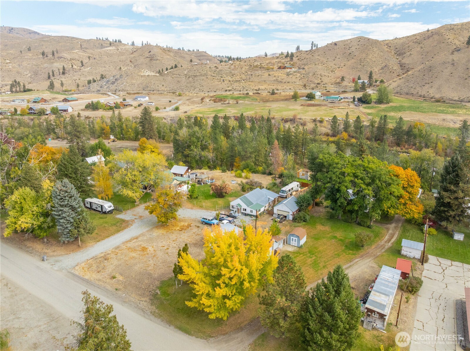 38 A Main Street Methow, WA 98834 - Photo 27 of 34 an aerial view of residential houses with outdoor space and lake view