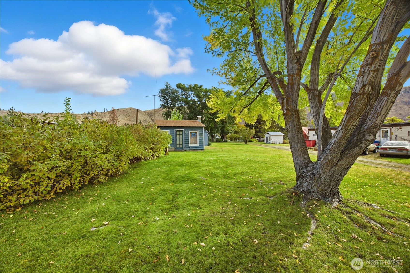 38 A Main Street Methow, WA 98834 - Photo 9 of 34 a view of a garden with a bench