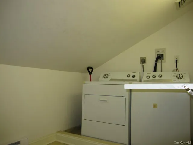 a room with a sink and cabinets