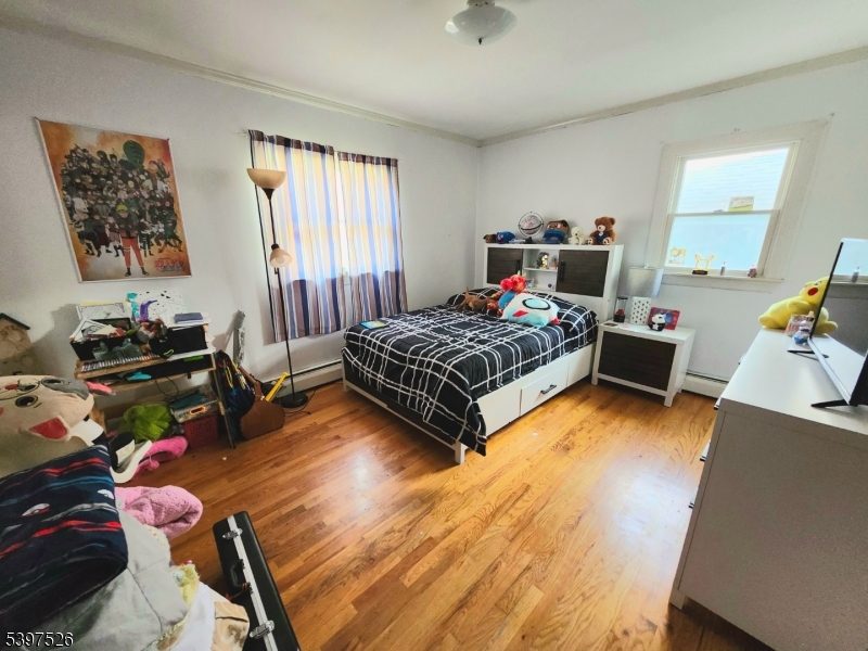 12 Old Coach Road Vernon, NJ 07462 - Photo 12 of 19 a bedroom with a bed and wooden floor