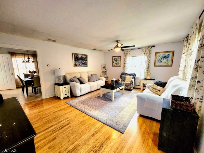 12 Old Coach Road Vernon, NJ 07462 - Photo 5 of 19 a living room with furniture and a lamp
