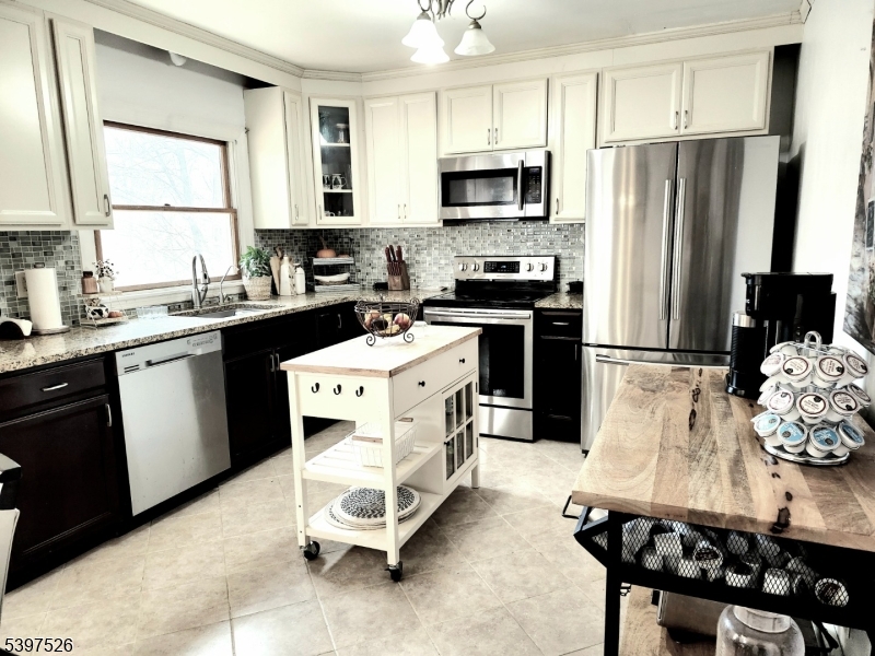 12 Old Coach Road Vernon, NJ 07462 - Photo 6 of 19 a kitchen with a sink appliances and cabinets